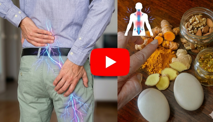 Person holding lower back due to sciatic nerve pain radiating down the leg